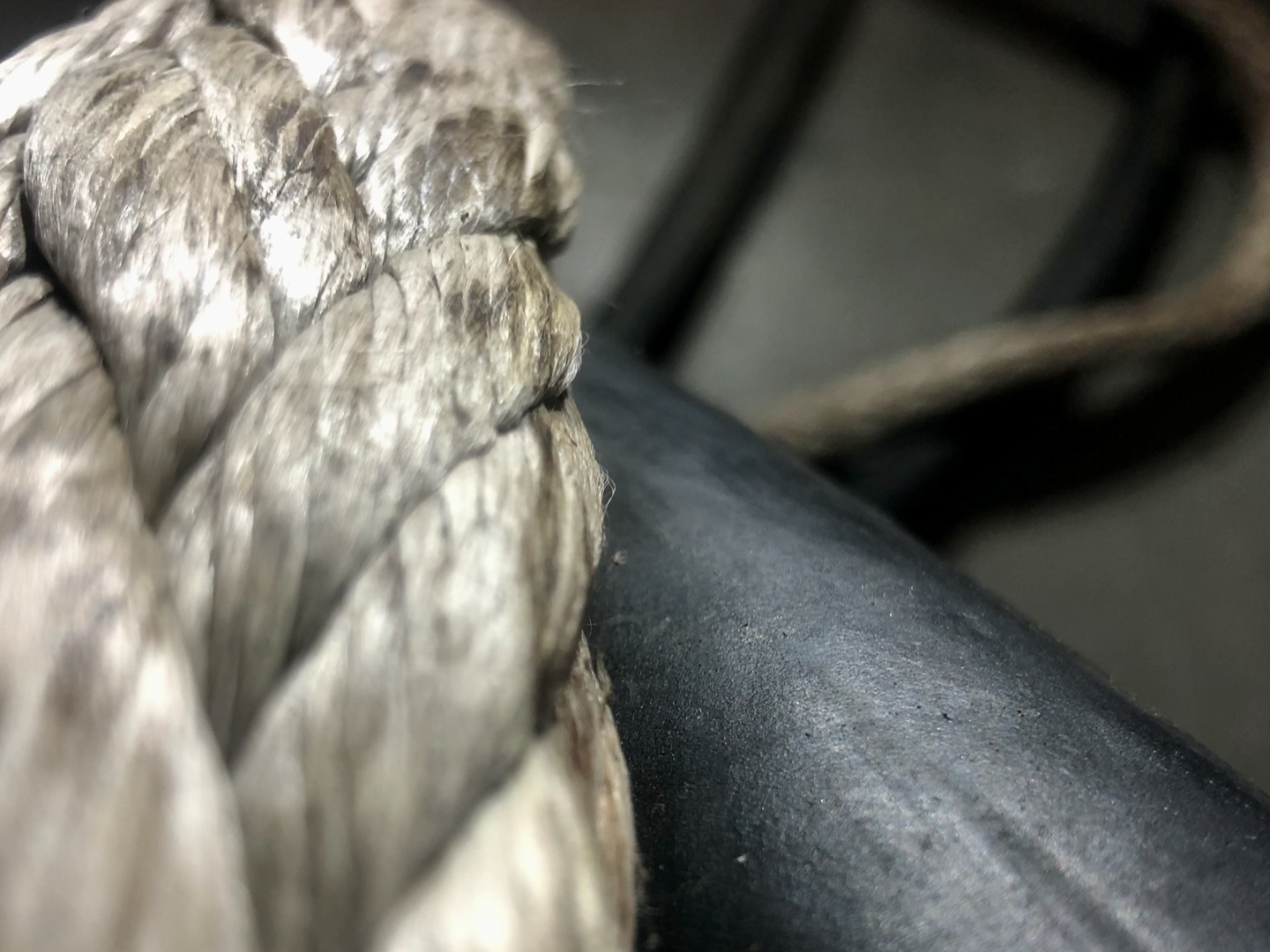A close up image of a mooring rope and electric cable